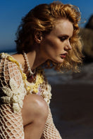 Multicolor handmade crochet top by Andreeva, featuring intricate crochet patterns and a relaxed fit, displayed on a model.