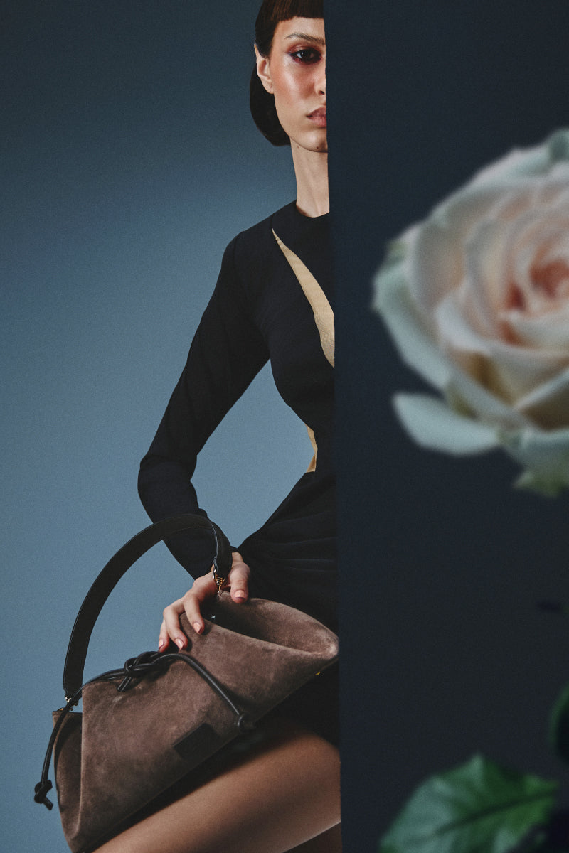 Taupe Arabesque bucket bag by Rose de Mai featuring a stylish shoulder bag design with a rounded shape and decorative details.