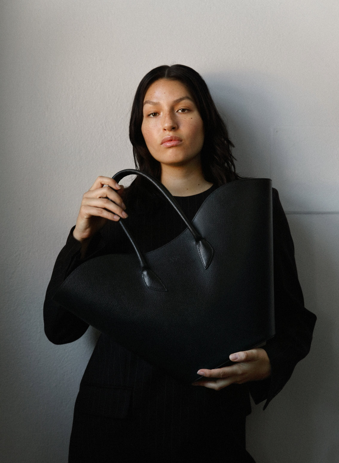 Black Willow shoulder handbag by ASK Scandinavia with sleek design and top handle, perfect for everyday style.