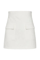 Izakova Atena off-white mini skirt displayed on a hanger with a clean background, showcasing its simple, stylish design.