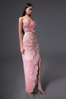 Pink CULT MIA X HAPPY CLOTHING pegged sleeveless taffeta gown displayed on a hanger, showcasing its elegant design and vibrant color.