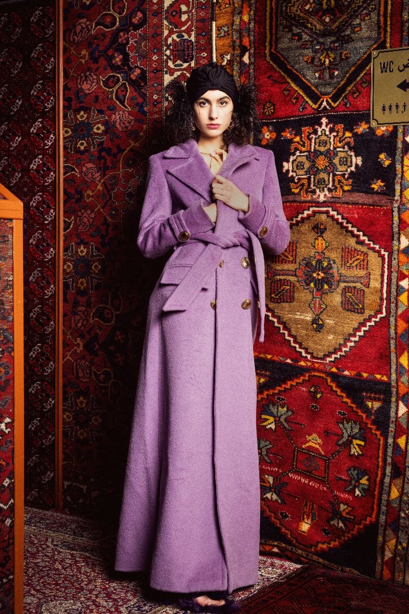 Nana Gotti jade double-breasted cashmere-wool coat displayed on a hanger, showing its tailored fit and elegant design.