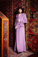 Nana Gotti jade double-breasted cashmere-wool coat hanging on a rack, showcasing its tailored design and elegant fabric.