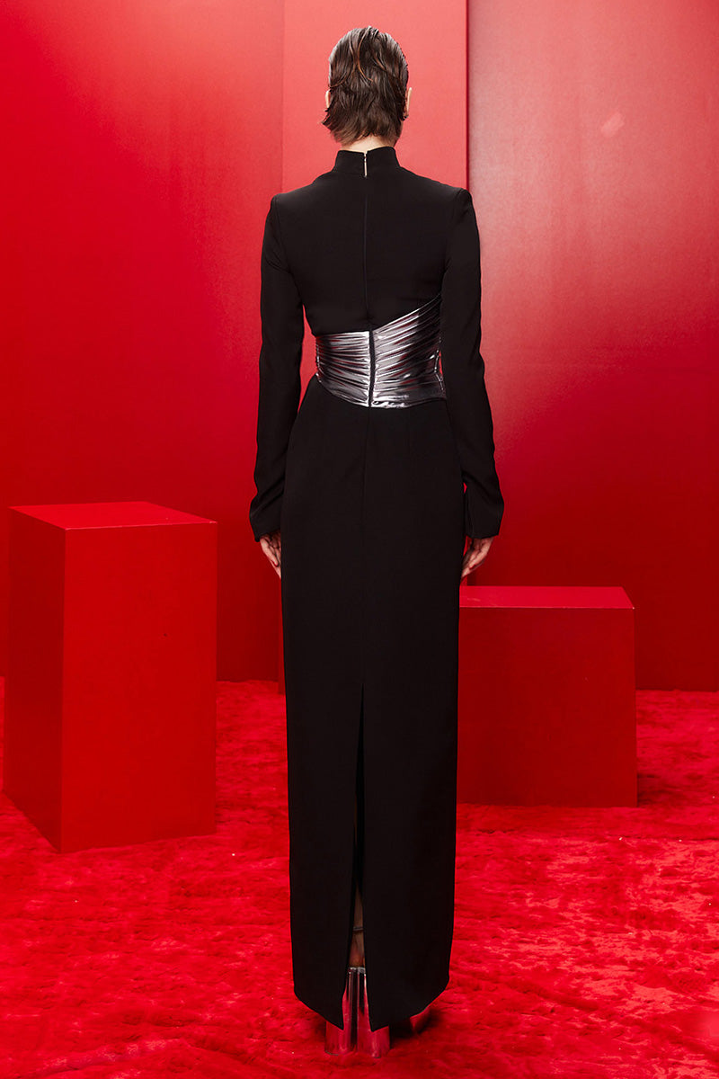 Joanna Andraos midnight black halterneck gown with metallic draped waist, shown from the back. Elegant evening dress.