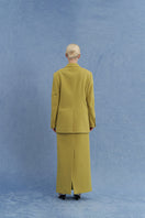 Back view of JINSUN double-breasted green wool jacket, showcasing classic collar, shoulder details, and tailored fit.