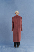Pink oversized Suri alpaca coat by JINSUN shown from the back with plush, textured fabric and relaxed fit.