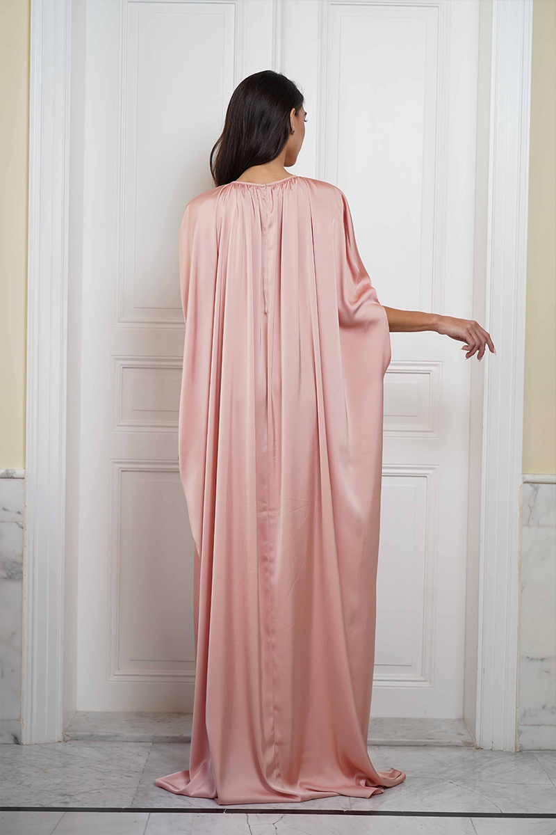 Joanna Andraos Cult Mia X Joanna Andraos soft nude silk gown, back view showing smooth fabric and elegant design.