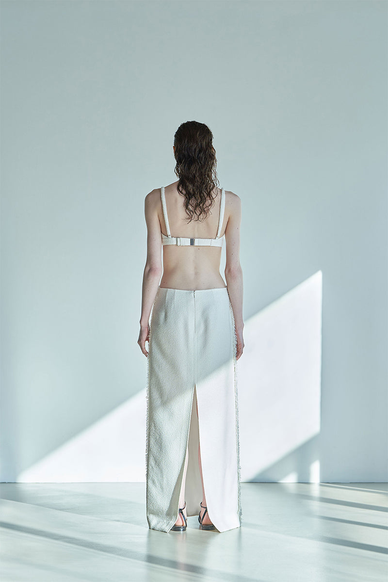 Back view of JINSUN ivory tweed Pappus Applique Bra Top, showcasing the textured fabric and stylish design.