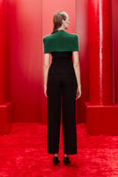 Joanna Andraos midnight black co-ords set with top and pants, featuring a detachable emerald cape from the back view.