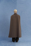 Back view of JINSUN long brown wool cape coat showcasing its elegant drape and classic design.