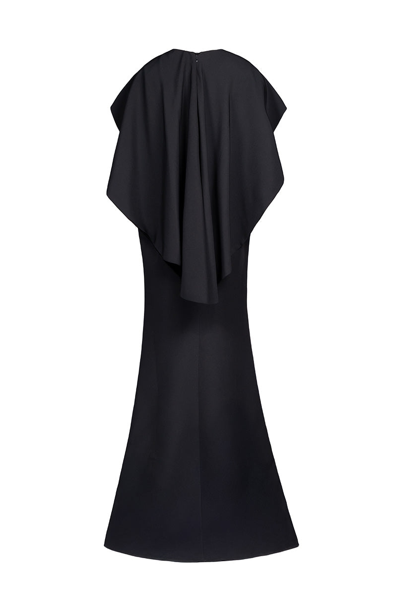 Back view of Joanna Andraos black cascade gown featuring flowing fabric and elegant design in a full-length gown.