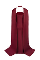 Back view of Joanna Andraos burgundy twist gown showcasing elegant draping and fitted silhouette on a model.