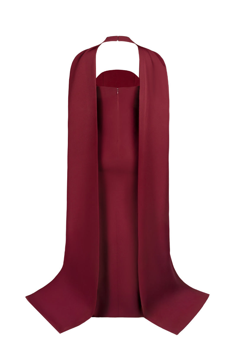 Back view of Joanna Andraos burgundy twist gown showcasing elegant draping and fitted silhouette on a model.