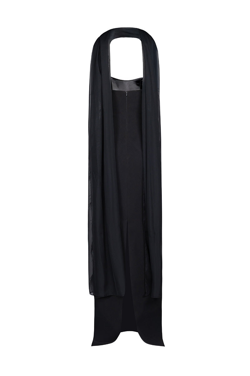 Black feather corset gown by Joanna Andraos, showing the back view with intricate feather detailing and fitted silhouette.
