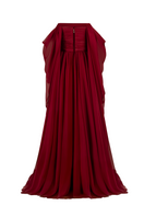 Red strapless gown by Joanna Andraos, shown from the back with a flowing, elegant design and fitted bodice.