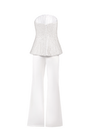 White corset top with flared trousers co-ords set by Joanna Andraos, shown from the back on a model.