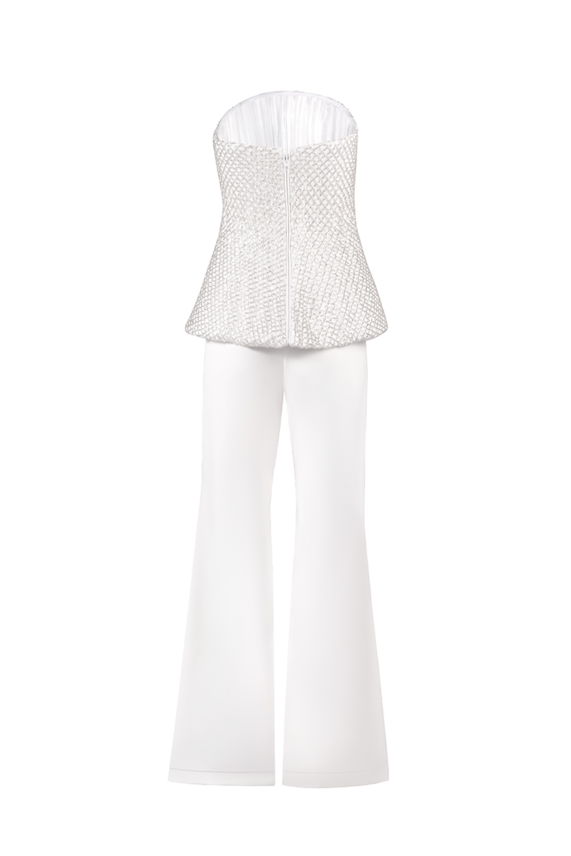 White corset top with flared trousers co-ords set by Joanna Andraos, shown from the back on a model.