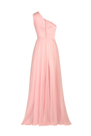 Baby pink one-shoulder gown by Joanna Andraos, shown from the back with flowing fabric and elegant design.