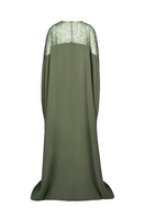Back view of Joanna Andraos embroidered olive green gown with intricate details and flowing fabric.