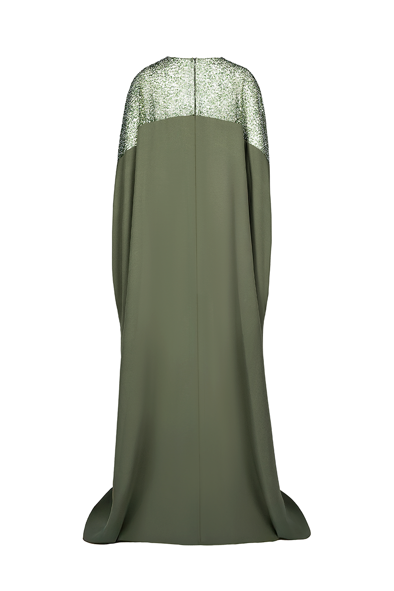 Back view of Joanna Andraos embroidered olive green gown with intricate details and flowing fabric.