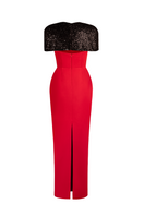 Red strapless tube gown with attached cape by Joanna Andraos, shown from the back highlighting elegant design and flowing fabric.