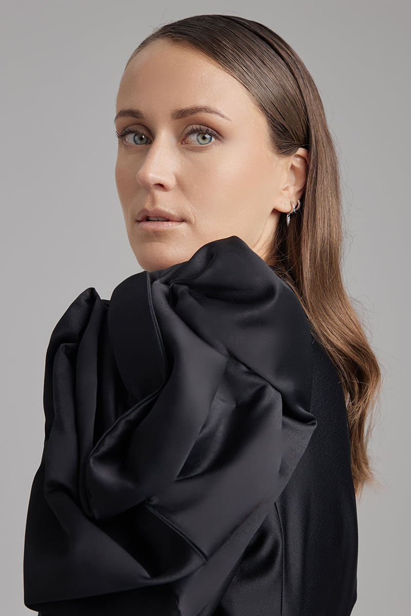 Black blazer from BAÉ Rose Jet collection, stylish tailored blazer with sleek design and structured fit.