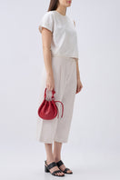 Red INA Mini Crossbody Pebble Bag by behno New York, top handle style with textured pebble leather and compact design.