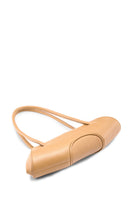 Behn New York Elizabeth Baguette Mini Pebble Top Handle Bag in peach with rounded shape and textured pebble leather.