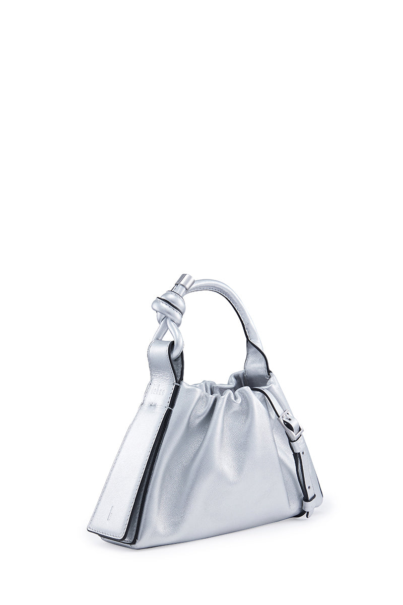 Silver Behno New York Tina Baguette Mini metallic ruched Saffiano top handle bag with a sleek, compact design.