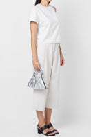 Silver Behno New York Tina Baguette Mini top handle bag with ruched saffiano leather, showcasing its metallic finish and compact design.