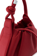 Red behno New York Tina Baguette Mini Nappa Ruched top handle bag with elegant design and ruched detailing.