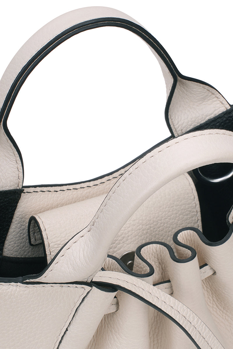 Behnò New York Katrina Mini Tote Pebble in Pumice showing close-up of textured pebble leather and shoulder strap detail.