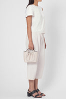 Behn New York Katrina Mini Tote Pebble in Pumice, a stylish shoulder bag with a textured pebble finish, shown on model.