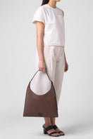 Large canvas Danny flatiron shoulder bag in cacao and black, featuring a spacious design and durable handles by behno New York.