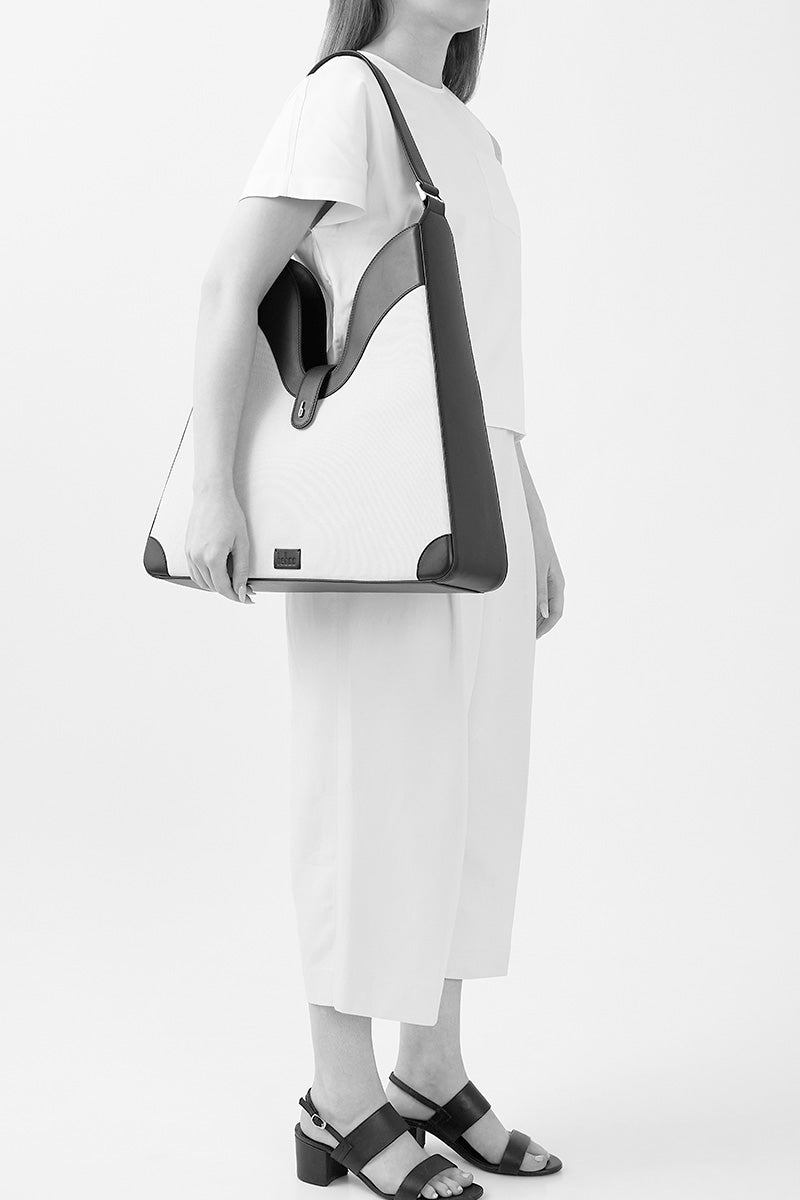 Behno New York MELINA shoulder bag in canvas with cacao and black color blocking, featuring a sleek, modern design.