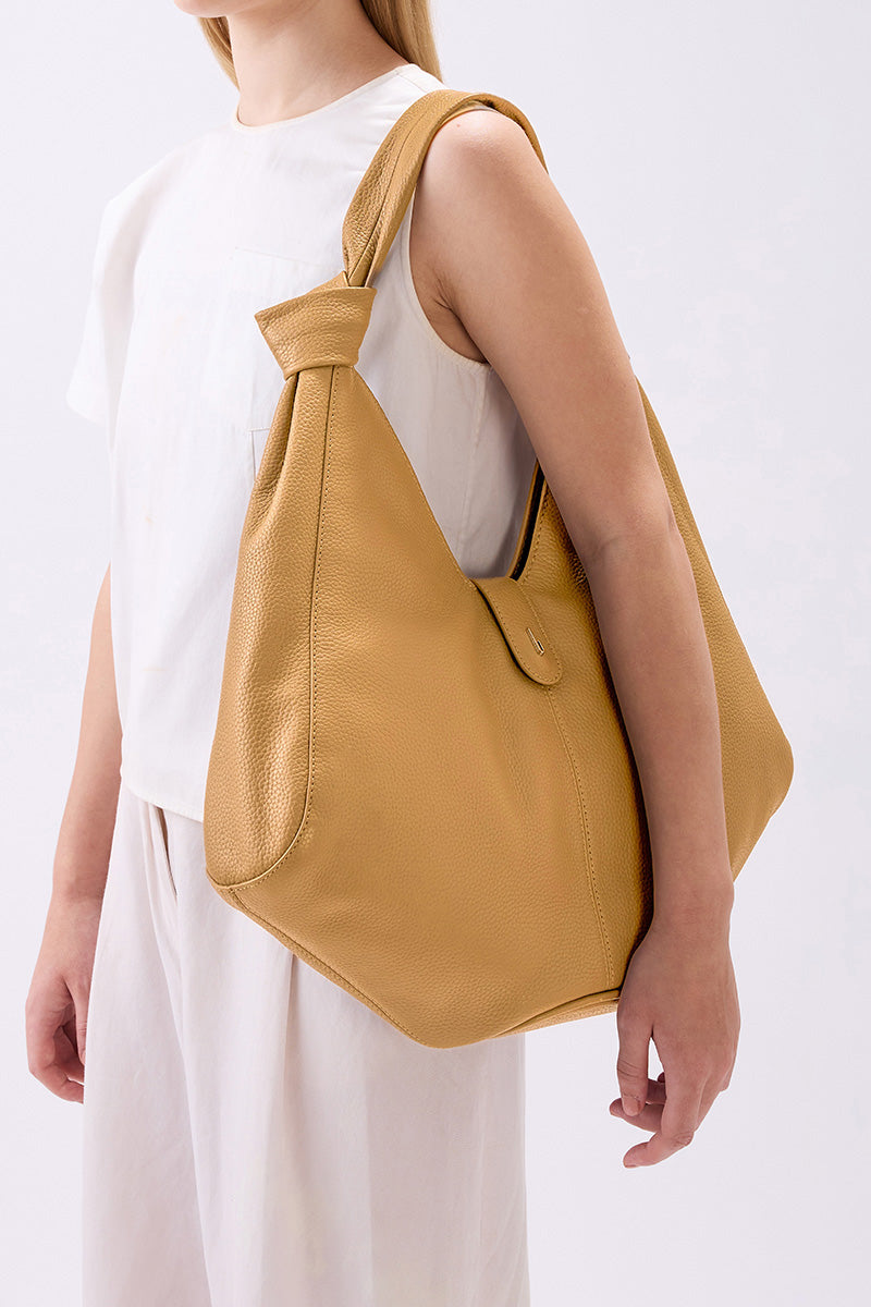 Large NELLI HOBO Pebble Bisque shoulder bag by behno New York, featuring soft pebble texture and spacious design.