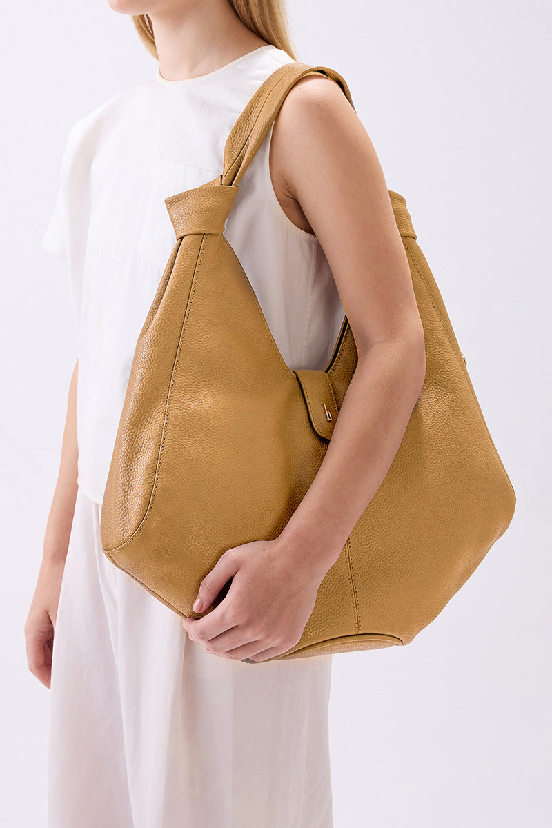 Large NELLI HOBO shoulder bag in pebble bisque leather by behno New York, featuring a soft, rounded shape and minimalist design.