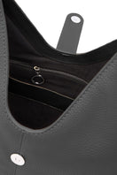 Black Nelli Hobo Large Pebble shoulder bag by behno New York, showing the interior and textured pebble leather material.