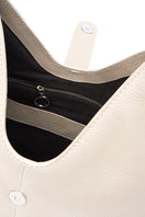 Interior view of the behno New York Nelli Hobo Large Pebble Shoulder Bag in Bone, showing spacious interior and high-quality craftsmanship.