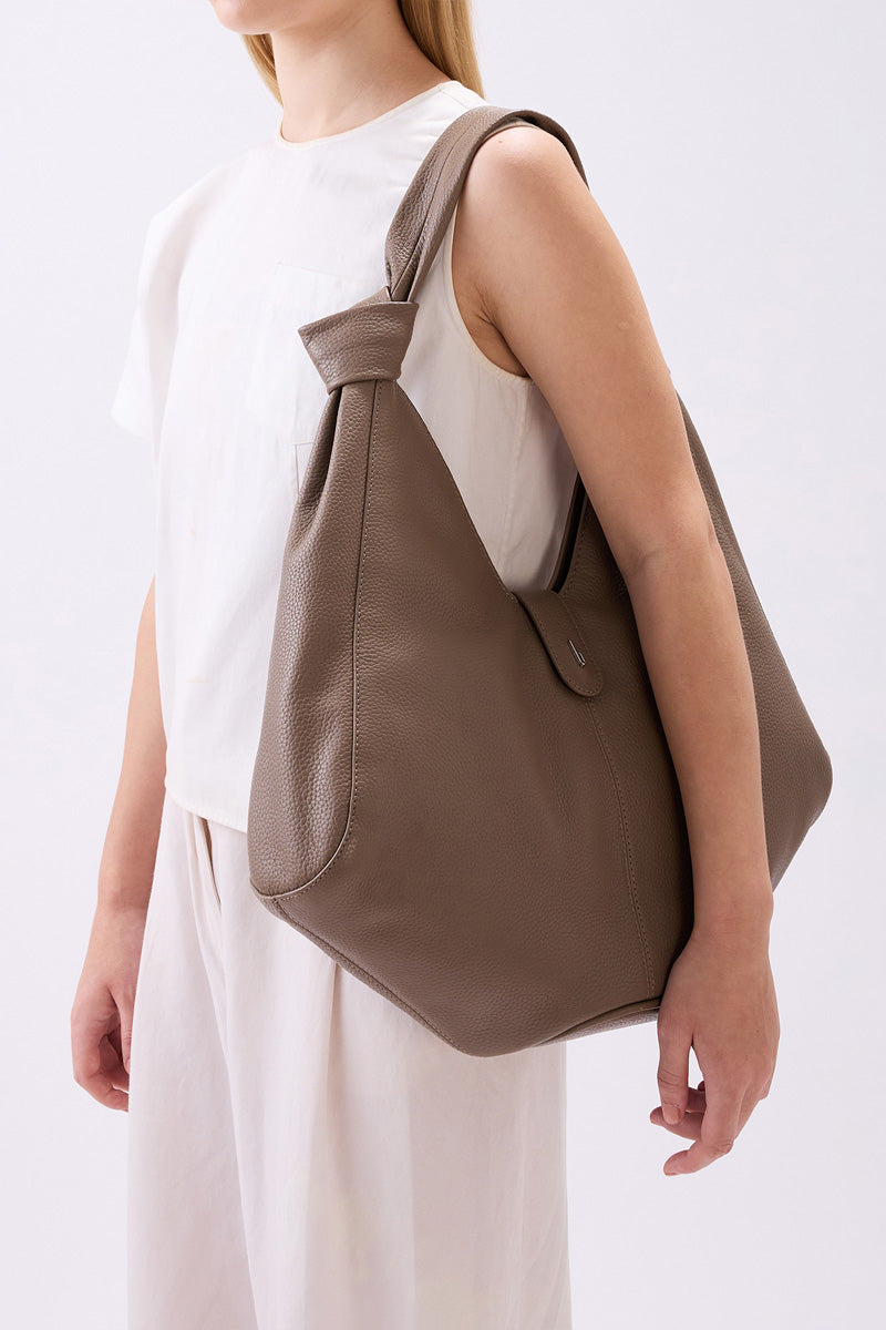 Large taupe Nelli Hobo shoulder bag by behno New York with pebble leather texture, featuring a relaxed, spacious design.