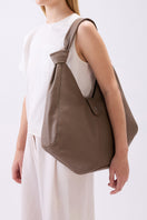 Large taupe Nelli Hobo shoulder bag by behno New York, featuring textured pebble leather and a slouchy hobo style.