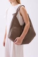 Large taupe Nelli Hobo shoulder bag by behno New York featuring pebble leather, slouchy design, and minimalistic style.