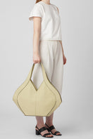 Behno New York Safra Tote Pebble in Mojave shown on body, featuring a stylish shoulder bag with pebbled leather texture.