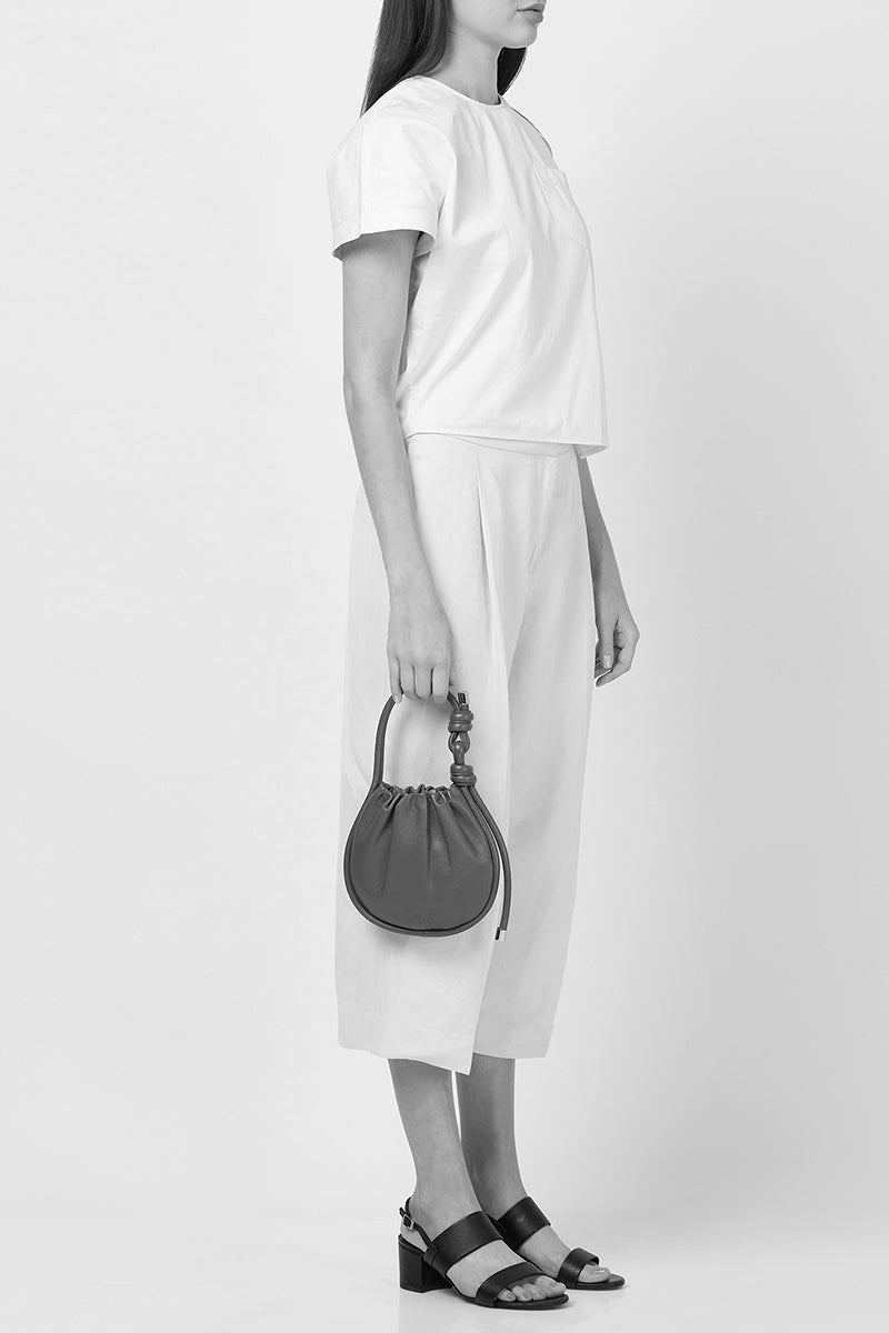 Behno New York INA Mini Potli Nappa Brick top handle bag with elegant design and rich brick-colored leather.