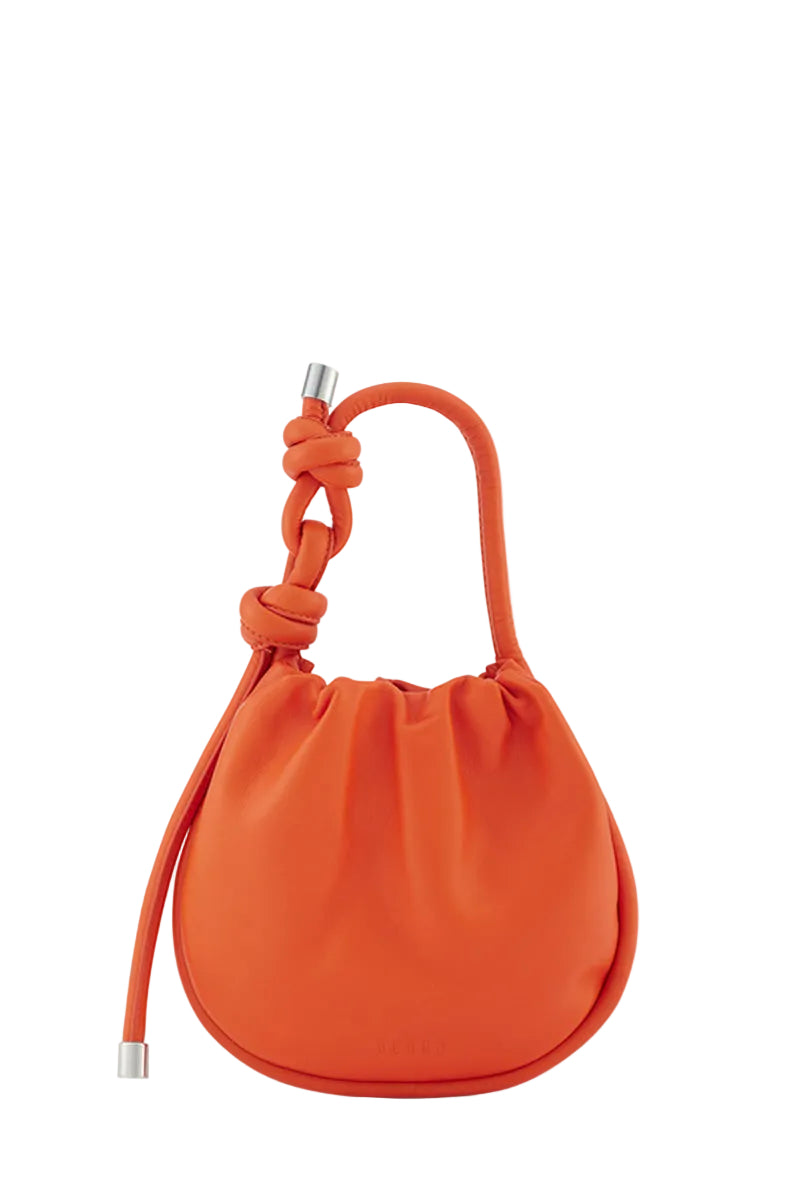 Behn0 New York INA Mini Potli Nappa Carrot top handle bag with orange leather and intricate detailing.