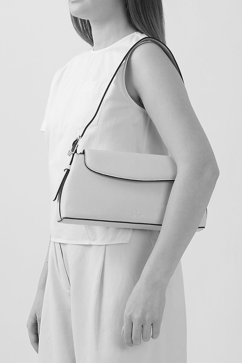 Behno New York Yara Baguette Crinkle Top Handle Bag in cherry color, shown with on-body view highlighting its textured design.