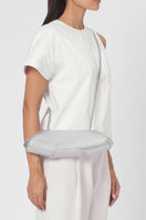 Silver Elizabeth Baguette Mini Clutch by behno New York, showcasing sleek, compact design with a smooth metallic finish.