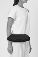 Behno New York Elizabeth Baguette Mini Clutch in hematite with sleek metallic finish, shown on model.