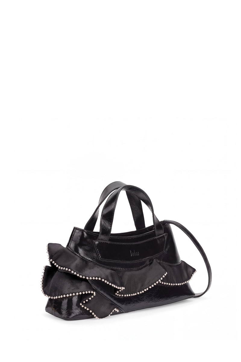 Black silk top handle bag with ruffle and crinkle texture by behno New York, showcasing elegant design and structured silhouette.