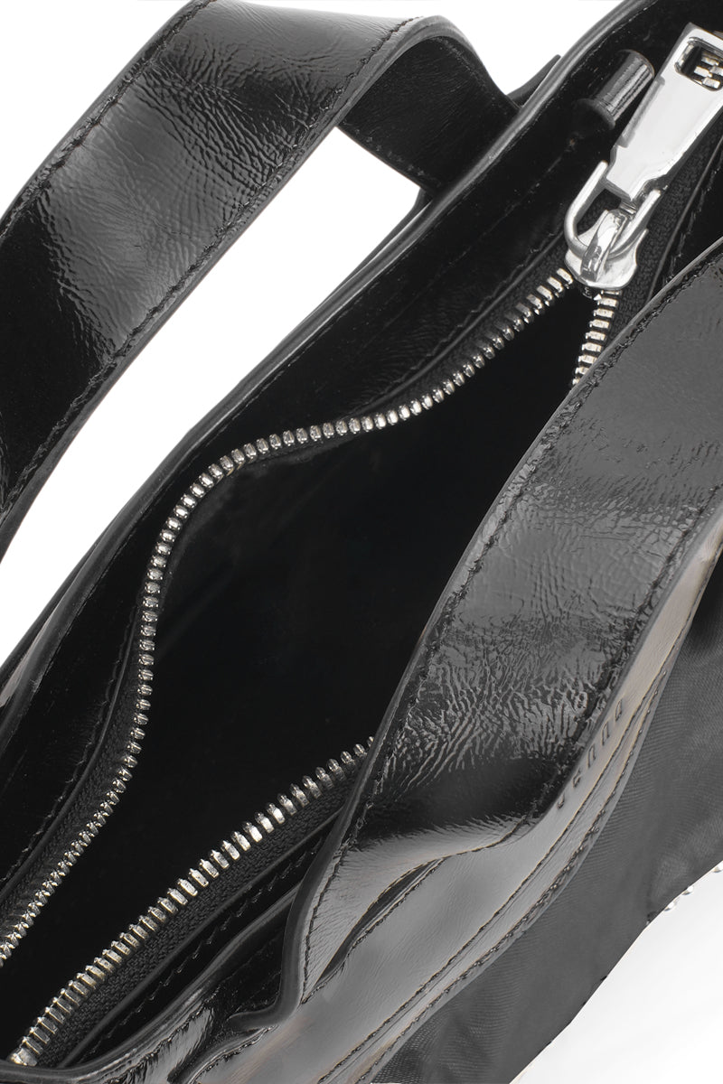 Black silk and crinkle top handle bag with ruffle detail from Behno New York, showcasing elegant design and craftsmanship.